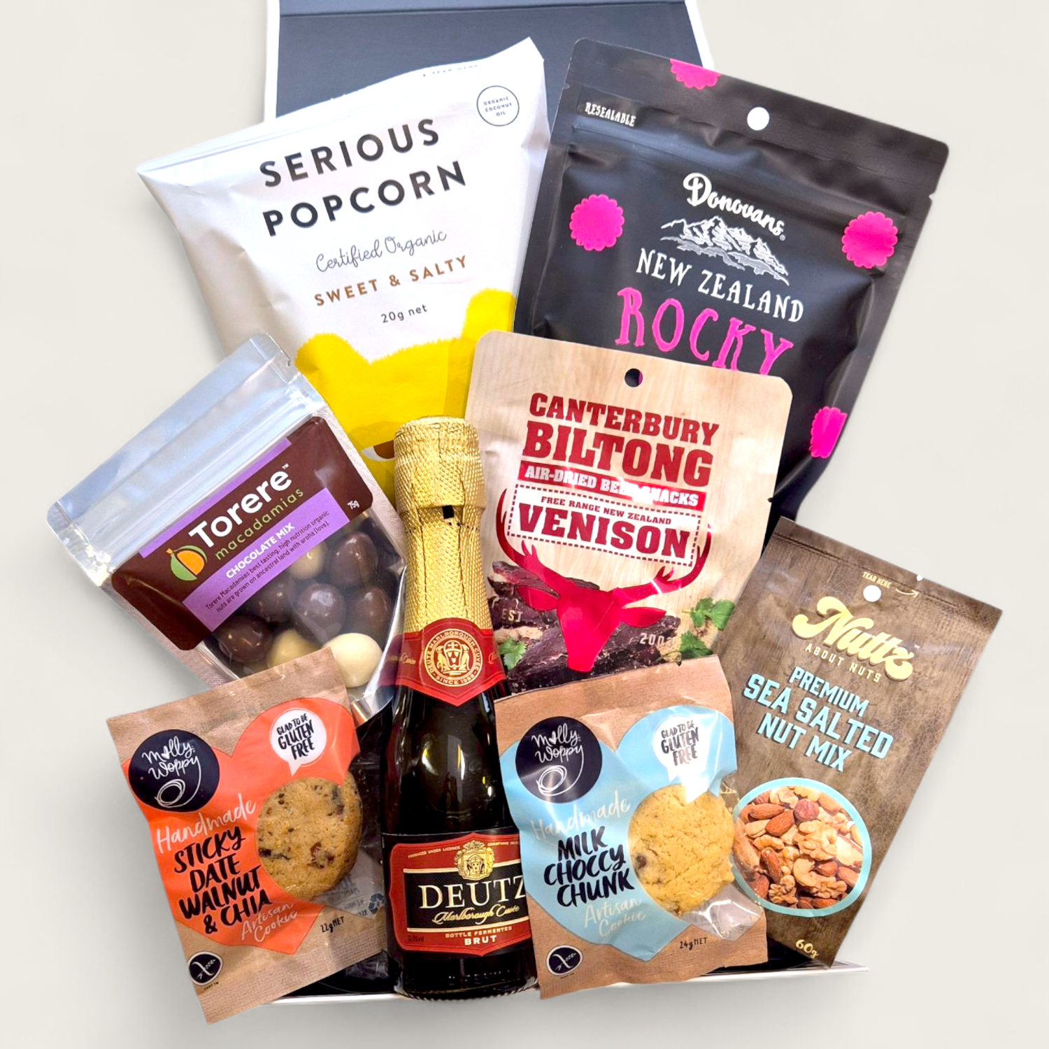 Wickedly Indulgent gift box with Deutz, artisan popcorn, venison biltong, cookies, and NZ gourmet snacks