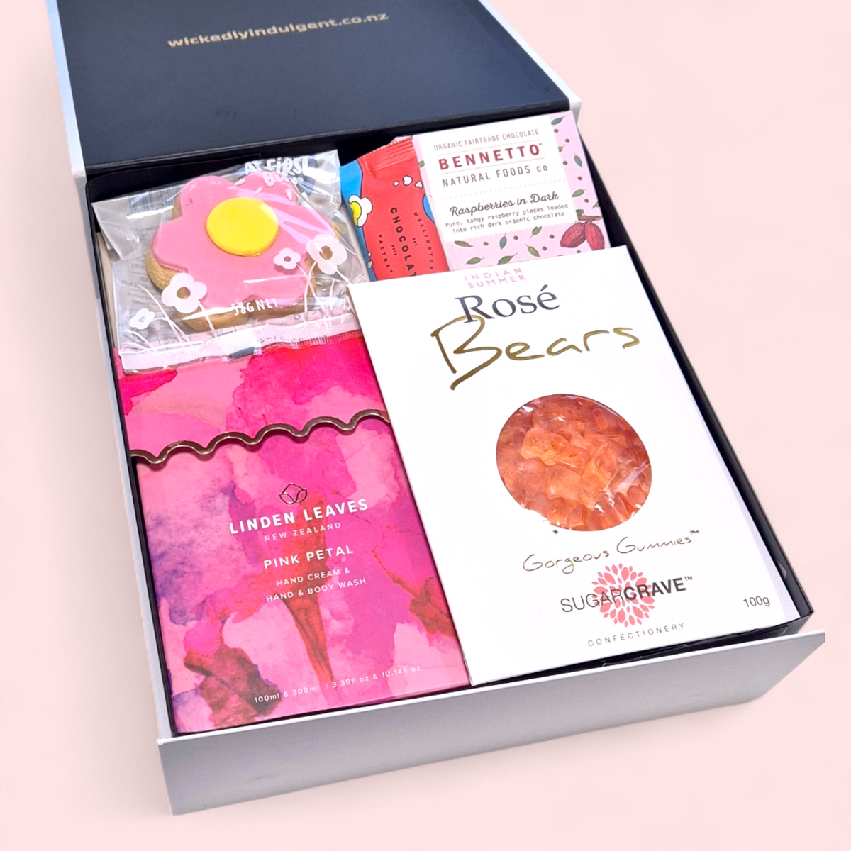 Pink themed pamper gift hamper for Mum with self care products and chocolates, NZ wide delivery