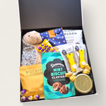 Easter gift hamper with soft toy bunny, popcorn, mint clusters, passionfruit curd and sweet treats in a gift box