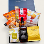 Gift box featuring Jack Daniel’s whiskey, gourmet snacks, corn nibbles, popcorn, and biscuits arranged in a black gift box – perfect for Father’s Day or gifting him.
