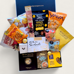 Non alcoholic gift hamper with an assortment of sweet and savoury snacks. Presented in a modern gift box.