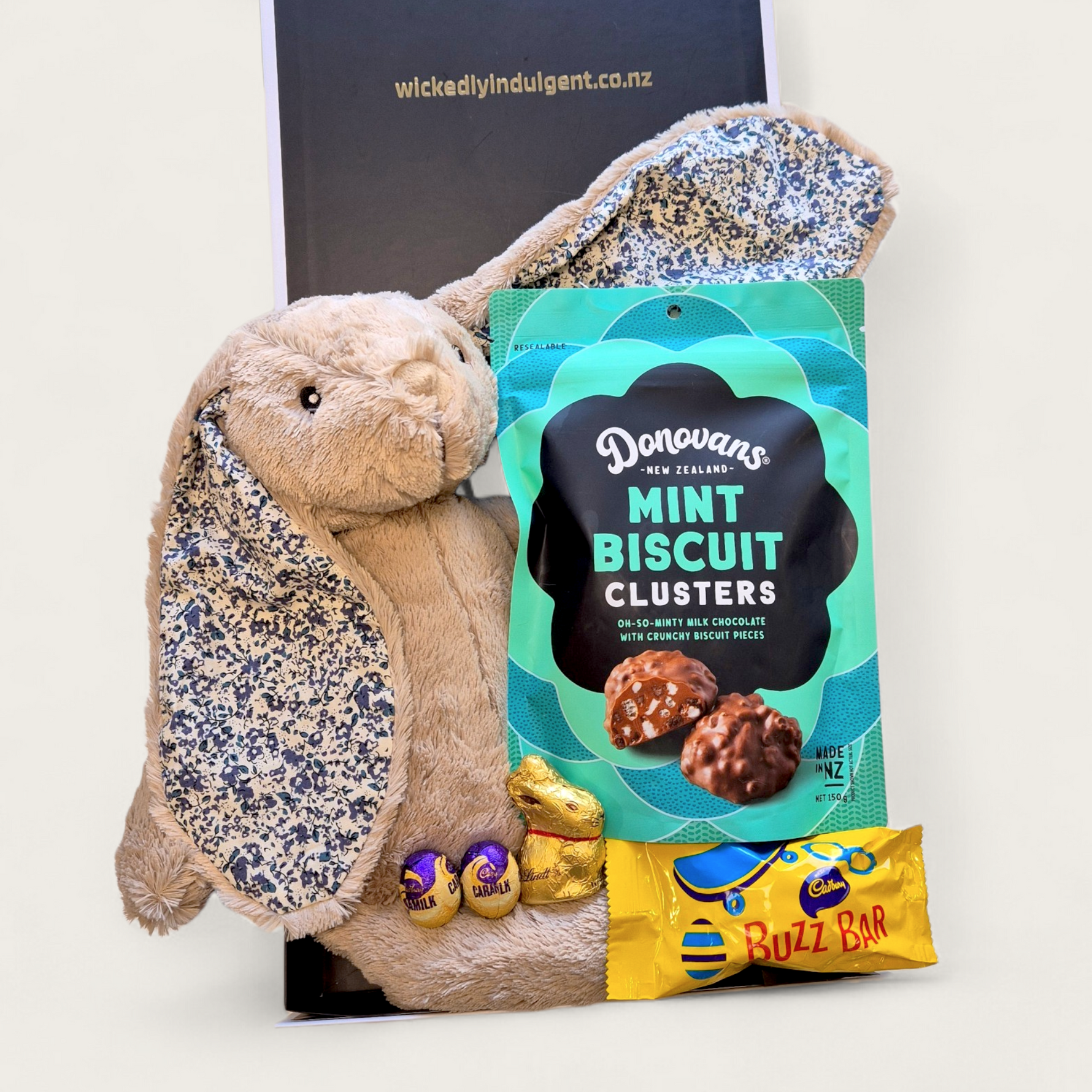 Kids Easter gift hamper with soft bunny toy, chocolates and sweet treats