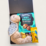 Easter gift box with plush bunny toy, mint biscuit clusters, Cadbury eggs and chocolate treats
