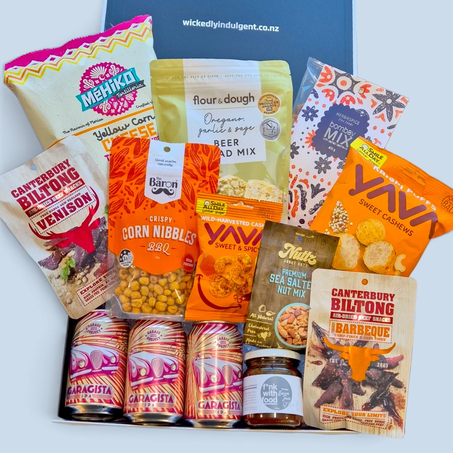 Premium craft beer and savoury snack gift hamper featuring beer, biltong, chips, cashews, nut mix and beer bread mix in a Wickedly Indulgent gift box.