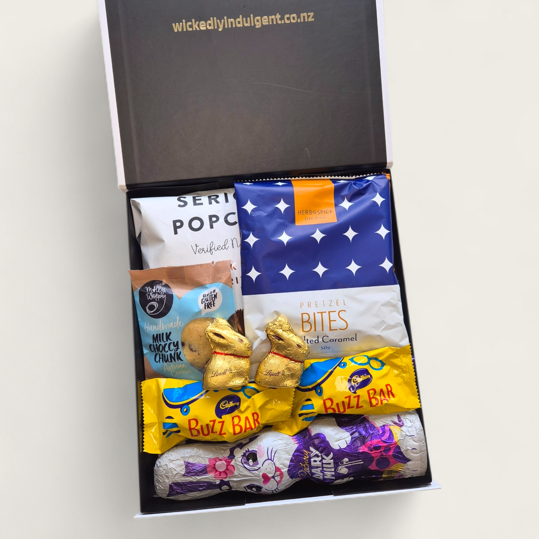 Easter gift hamper with cadbury chocolate bunny, popcorn and chocolate treats in gift box