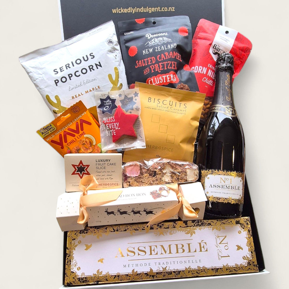 Tipsy elf treats gift box featuring snacks, gourmet treats and bubbly. Perfect for cheeky Christmas gifting.