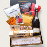 Tipsy elf treats gift box featuring snacks, gourmet treats and bubbly. Perfect for cheeky Christmas gifting.