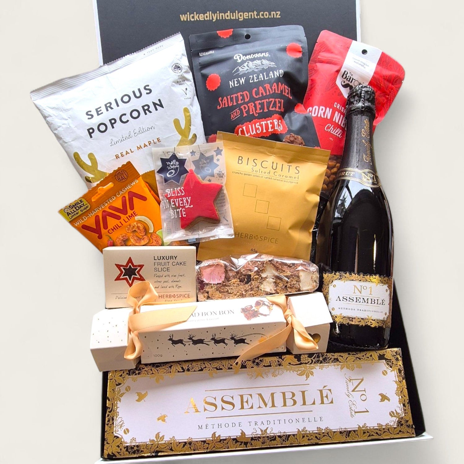Tipsy elf treats gift box featuring snacks, gourmet treats and bubbly. Perfect for cheeky Christmas gifting.