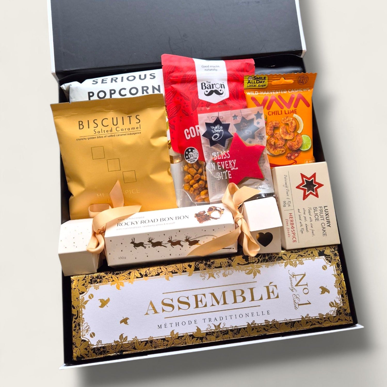 Tipsy elf treats gift box featuring snacks, gourmet treats and bubbly. Perfect for cheeky Christmas gifting.