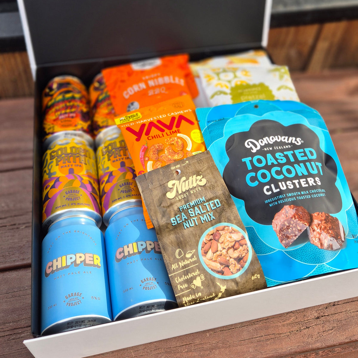 Tools Down gift hamper with craft beer, nuts, chocolate, pretzels and popcorn all presented in a modern gift box.