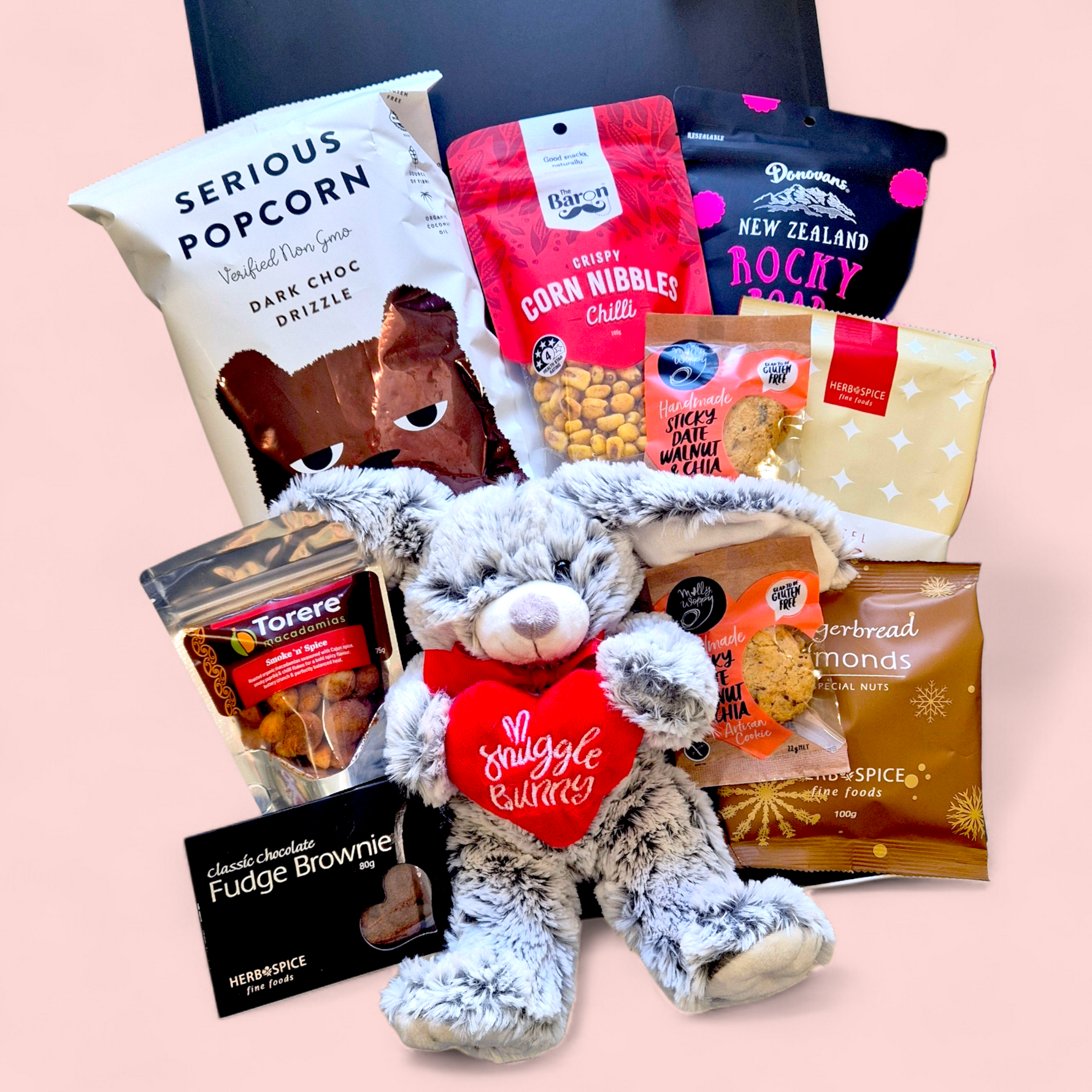 Valentine’s  gift box featuring gourmet treats, chocolate snacks, savoury nibbles and a plush snuggle bunny presented in a modern gift box