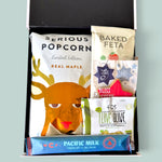 Christmas Cracker gift hamper featuring a chocolate-filled Christmas cracker, popcorn, festive gingerbread, chocolates and gourmet snacks, beautifully presented in a Wickedly Indulgent gift box