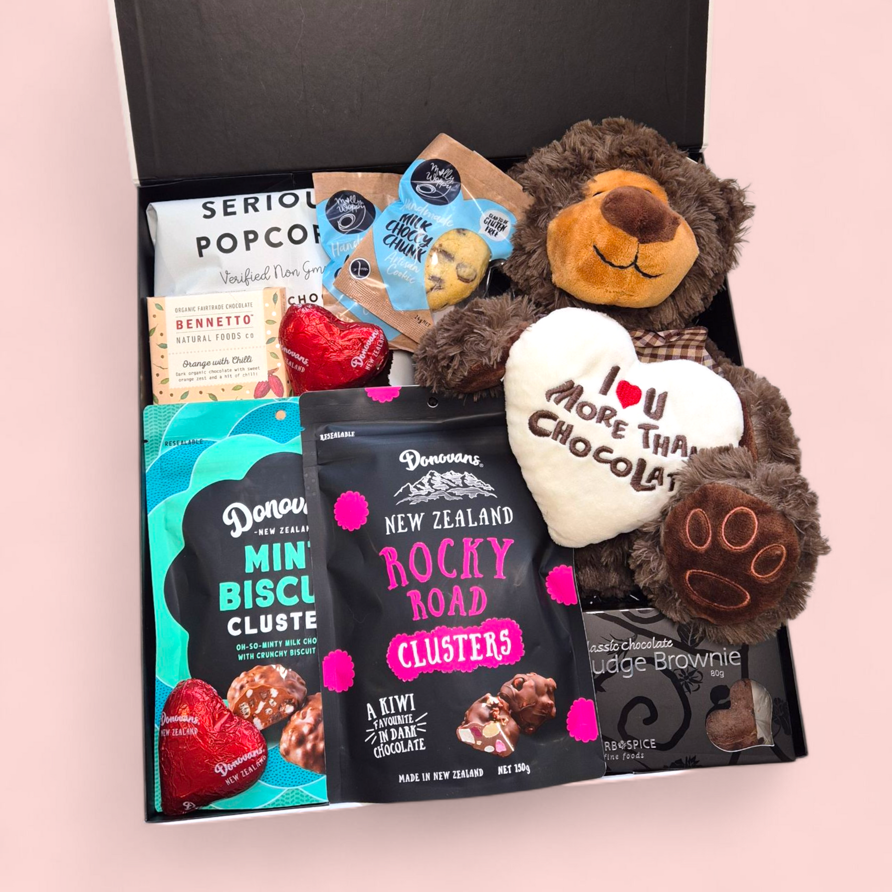 Romantic gift box with teddy and filled with chocolate