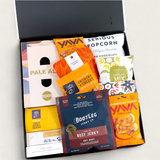 Beer Bonanza Gift hamper for the beer enthusiast filled with 6 craft beers and a large assortment of chocolate, chips, pocorn and snacks best enjoyed with beer. Presented in a modern gift box.