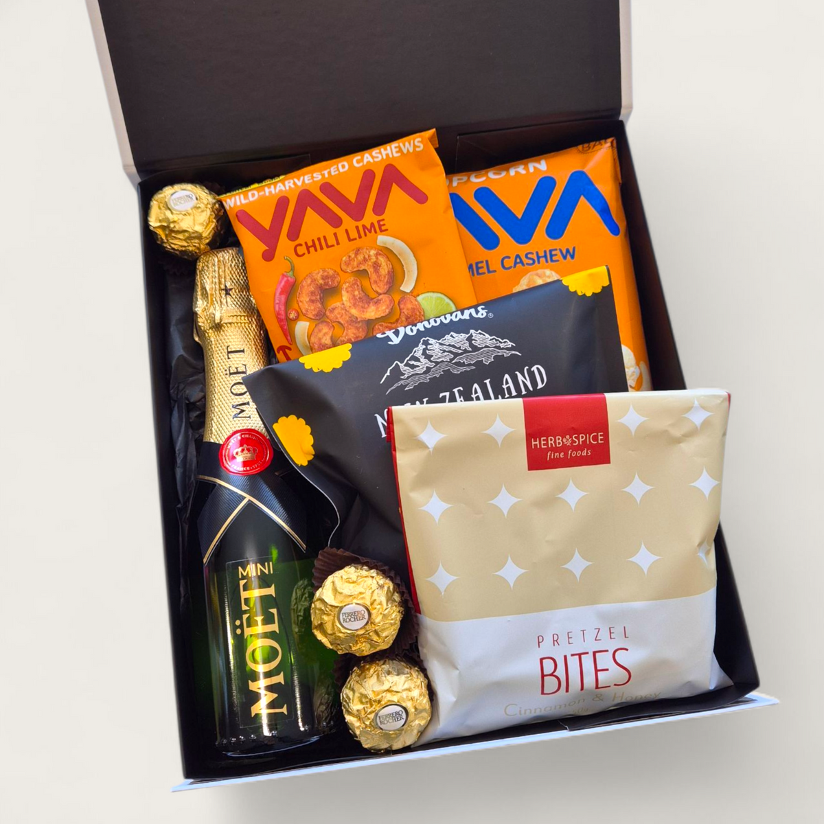 "Mini Champagne celebration gift box with Moët, chocolate, popcorn and pretzels