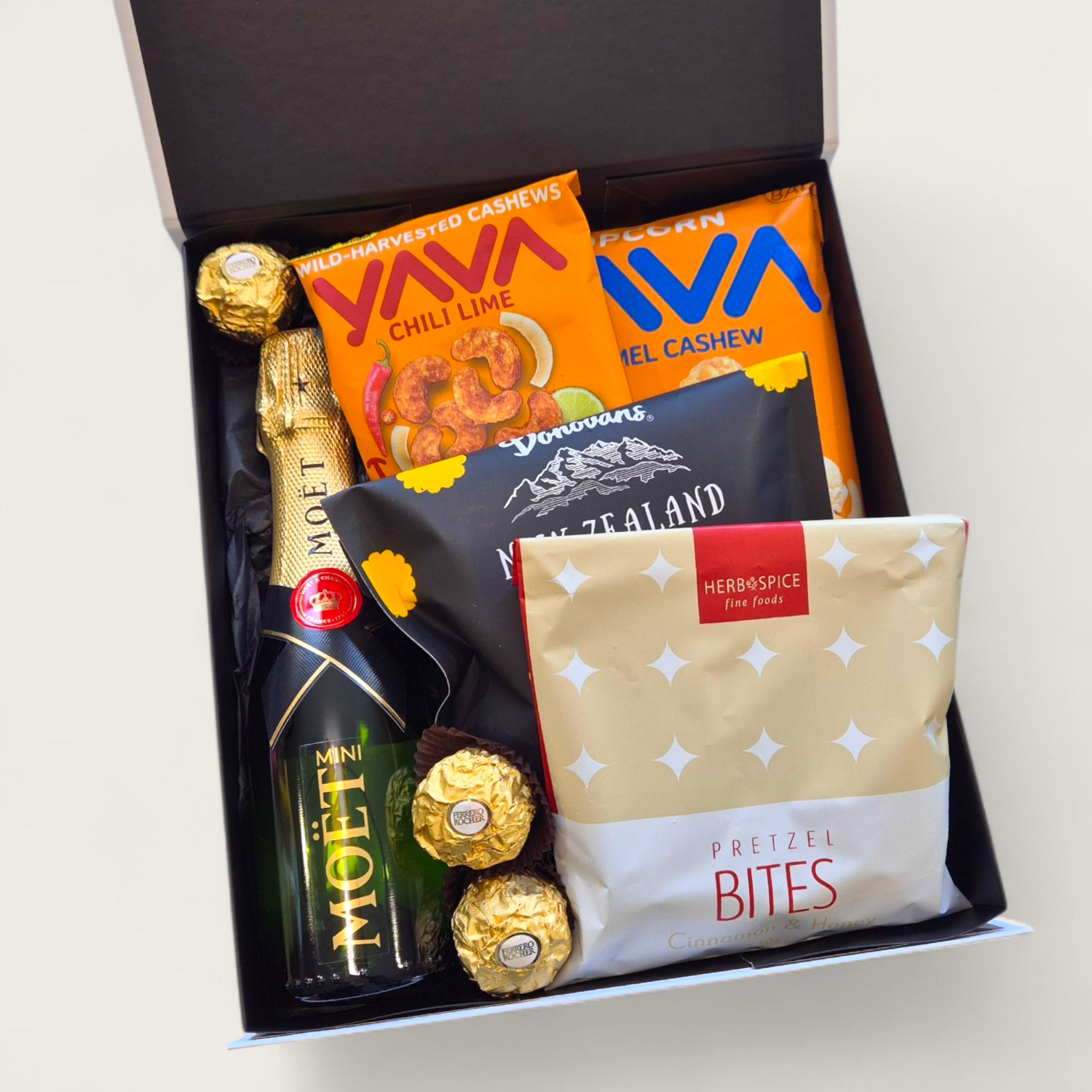 "Mini Champagne celebration gift box with Moët, chocolate, popcorn and pretzels