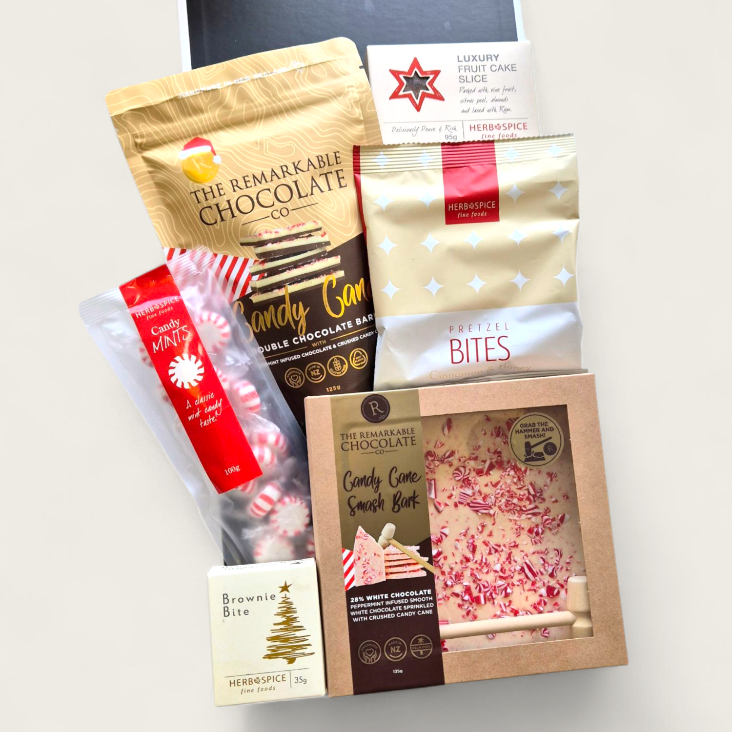 Candy Cane Wishes Christmas gift box with smash bark, brownie bites, pretzels and festive treats in a luxe black & white gift box.