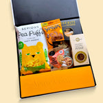 Luxury Champagne gift hamper presented in a Wickedly Indulgent gift box with Veuve Clicquot, cumin biscuits, fudge, nuts and savoury treats.