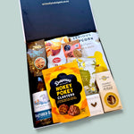 Cheers gift hamper with wine, popcorn, chocolate, fudge, brownie & nuts presented in a beautiful Gift Box.