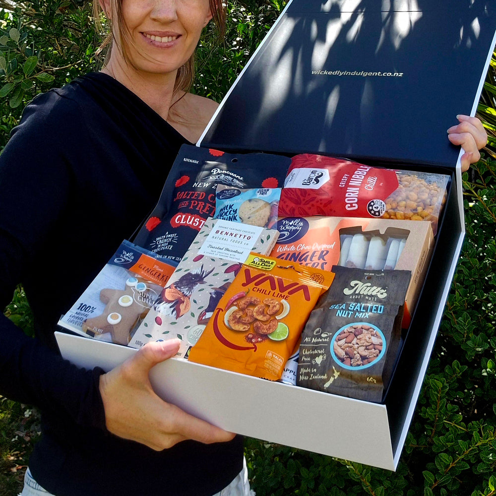 Person holding cider gift box.