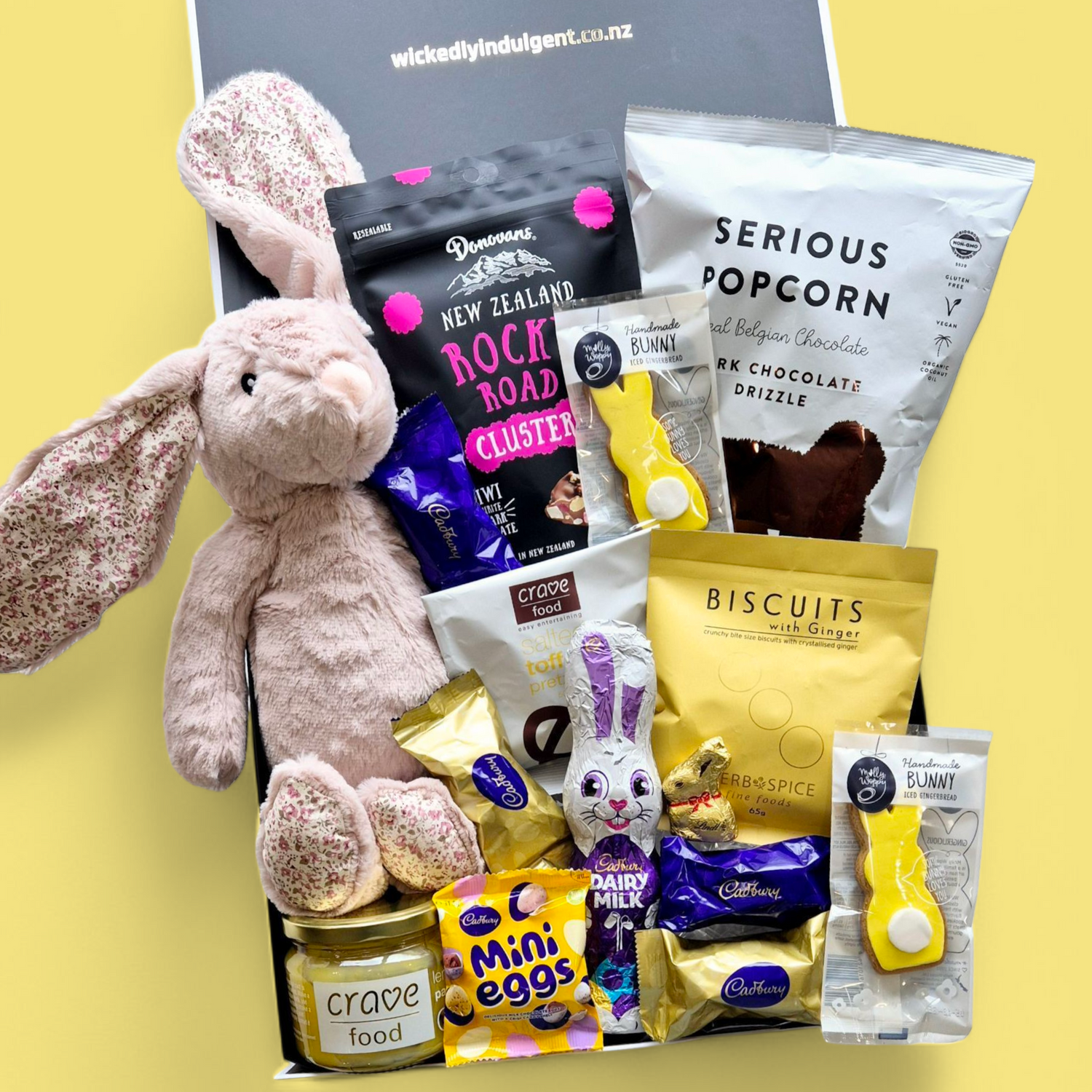 Easter gift box with soft toy bunny, Easter eggs and lemon curd. Presented in a modern gift box.