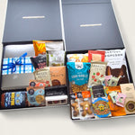 Wickedly Indulgent Eat. Sleep. Repeat. gift hamper with artisan cheese, chutney, chocolate, cookies and gourmet NZ treats
