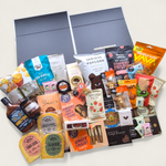 Wickedly Indulgent Eat. Sleep. Repeat. gift hamper with artisan cheese, chutney, chocolate, cookies and gourmet NZ treats