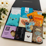 Guilty Pleasures gift basket with sweet and savoury treats all presented in a modern gift box.