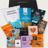 Guilty Pleasures gift basket with sweet and savoury treats all presented in a modern gift box.