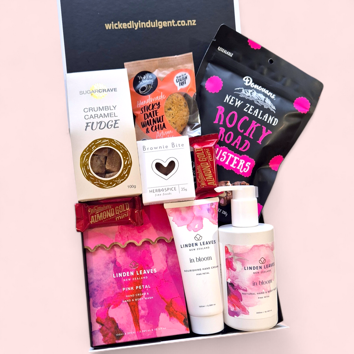 Relaxation gift box for Mum in pink tones with self-care products and chocolates, perfect Mother’s Day gift delivered NZ-wide