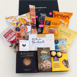 Non alcoholic gift hamper with an assortment of sweet and savoury snacks. Presented in a modern gift box.