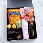 Petite Pleasure gift basket with Moet Champagne, Linden Leaves Bath Bombs and sweet treats.