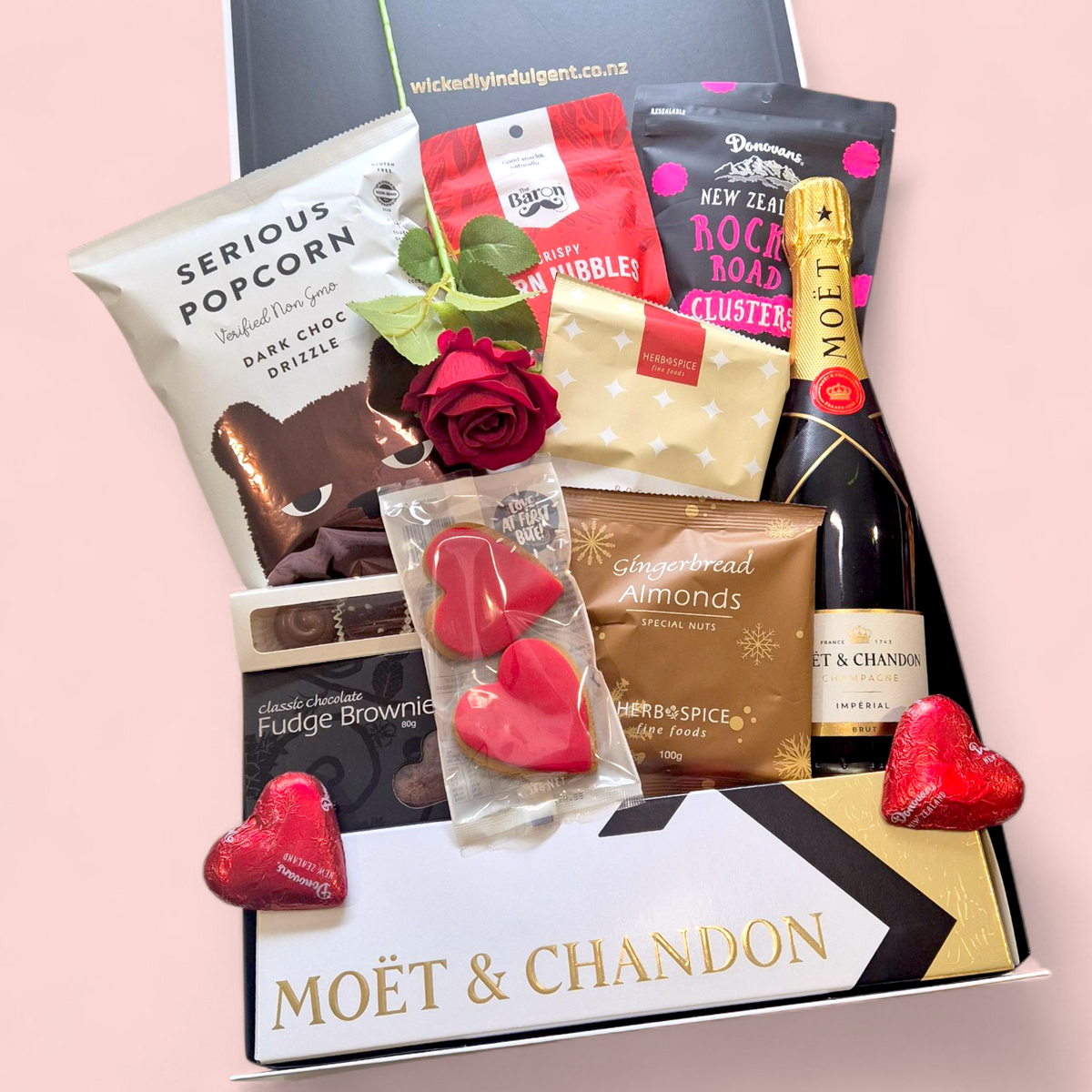 champagne, artificial rose and nibbles romantic gift box