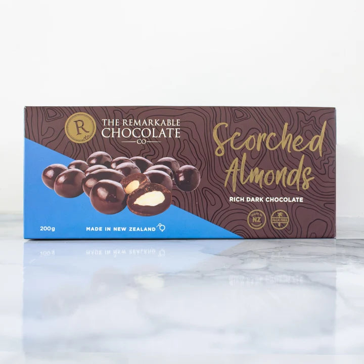 Remarkable Chocolate Co. Dark Chocolate Scorched Almonds 200g in blue and brown packaging, featuring chocolate-covered roasted almonds.