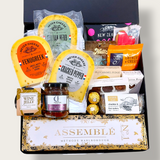 Simply the Best Champagne gift basket with Cheese, Chutney, Chocolate, Nuts & more all presented in a modern Gift Box.