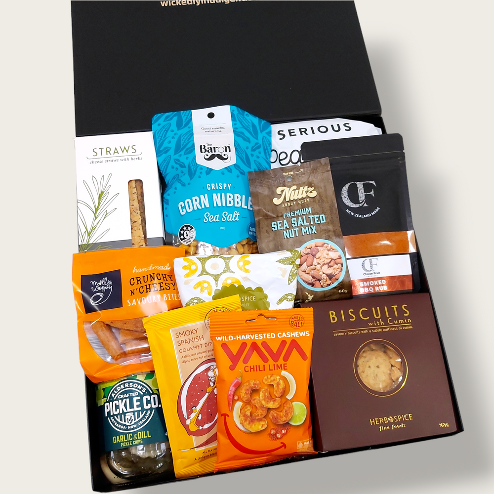 Savoury gift hamper with pickles, BBQ rub, olives, & cashews. Presented in a modern gift box.