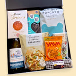 Gluten and dairy free gift box with wine, dairy free chocolate, cookies, popcorn and treats presented in a premium hamper box.