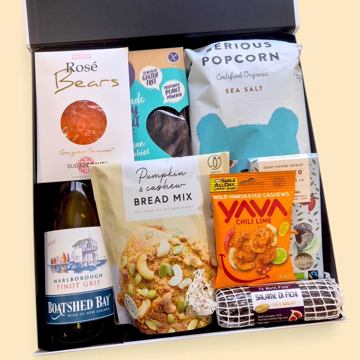 Gluten and dairy free gift box with wine, dairy free chocolate, cookies, popcorn and treats presented in a premium hamper box.