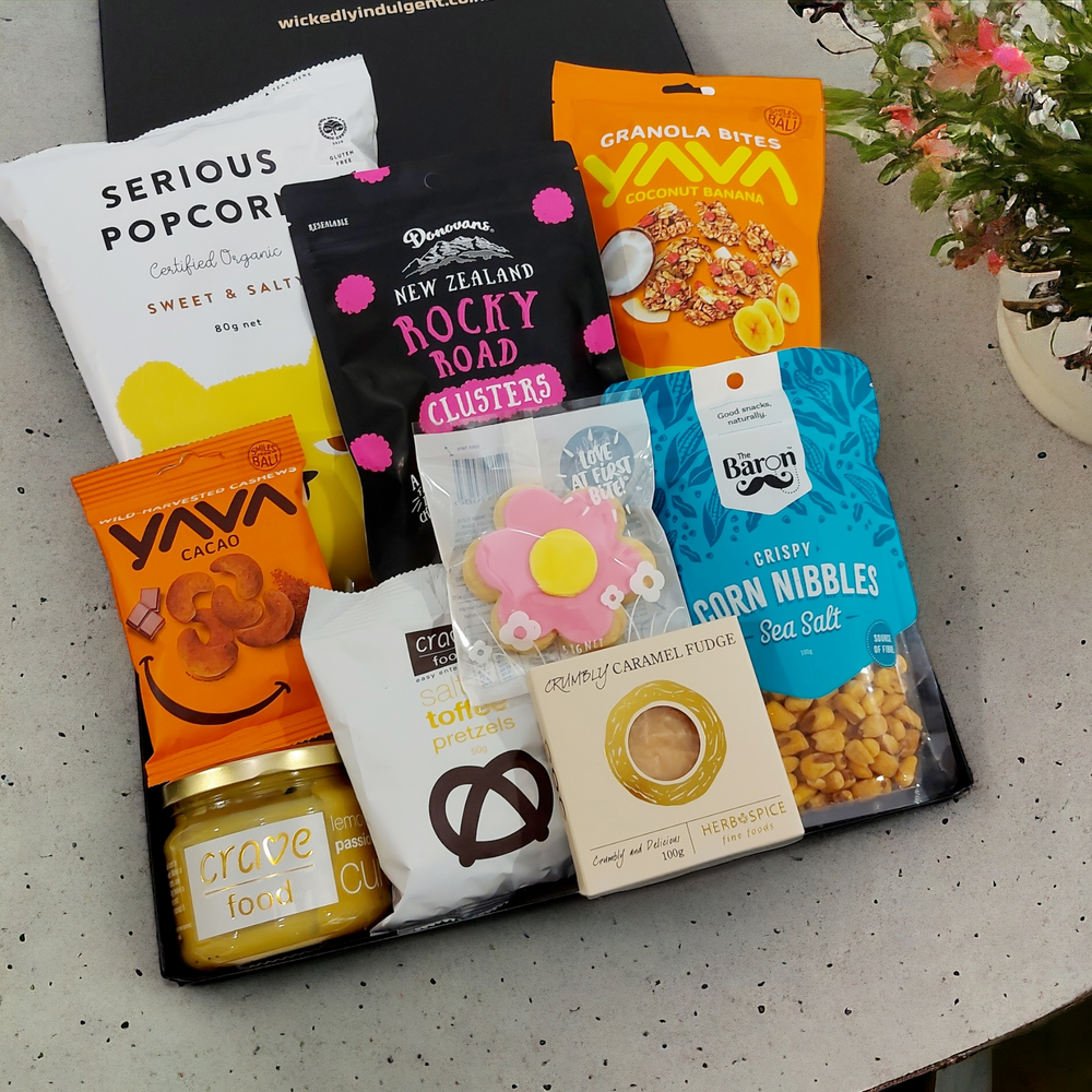 Sweet tooth gift hamper with passionfruit lemon curd, popcorn, granola bites, Russian fudge, chocolates and more, all presented in a modern gift box.