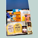 cheese and nibbles in a black gift box