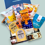 cheese and nibbles in a black gift box