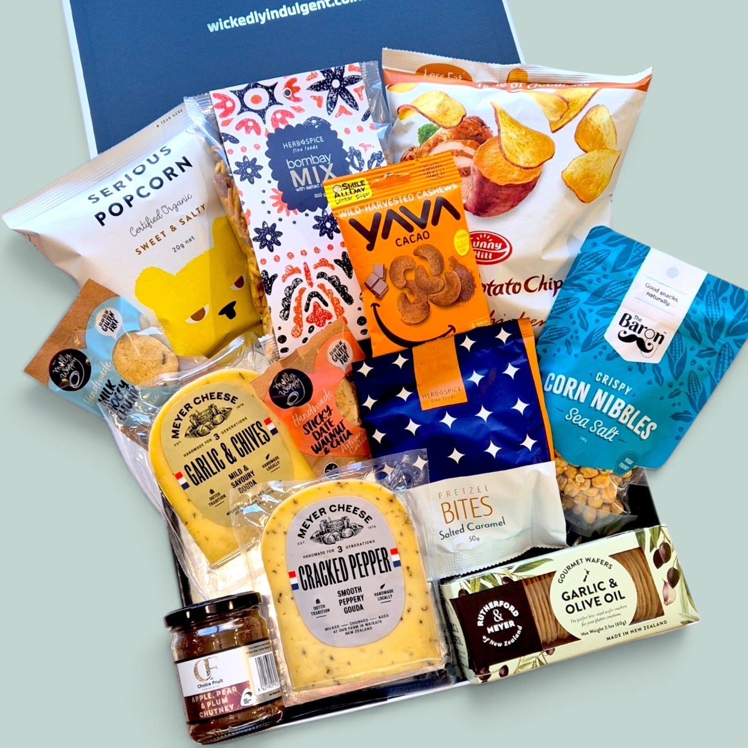 cheese and nibbles in a black gift box