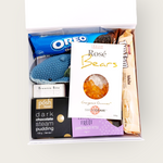 New baby Gift Hamper with Lily & George whale rattle, Tim tams, passionfruit shortbread & more. Presented in a modern gift box.