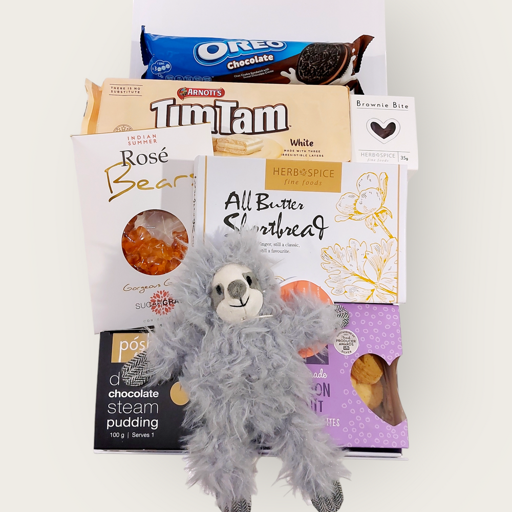 New baby Gift Hamper with Lily & George sloth rattle, tim tams, passionfruit shortbread & more. Presented in a modern gift box.
