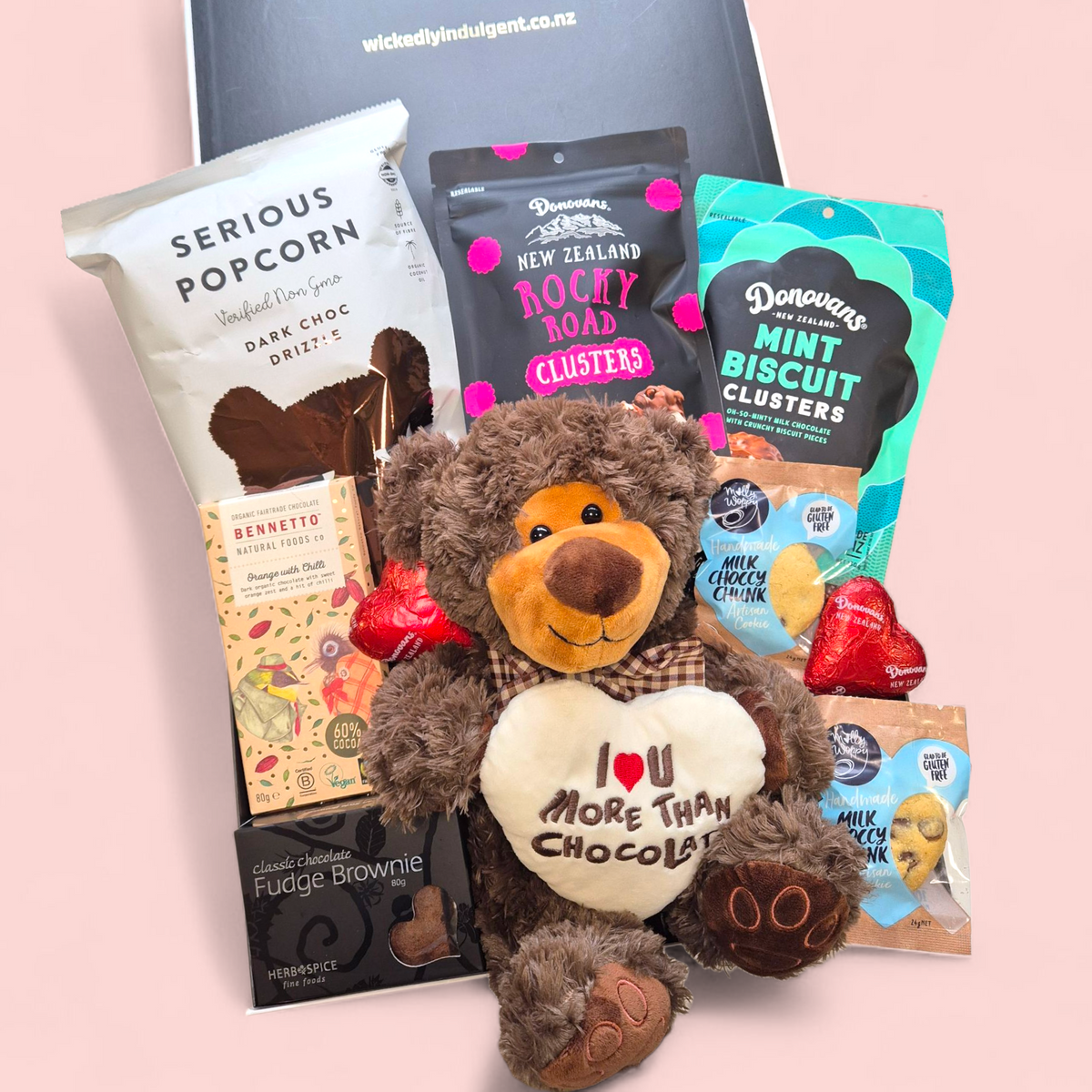 Romantic gift box with teddy and filled with chocolate