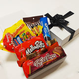 Chocolate lovers gift baskets with M&M's, Maltesers, &Toffee Pops presented in a modern gift box.