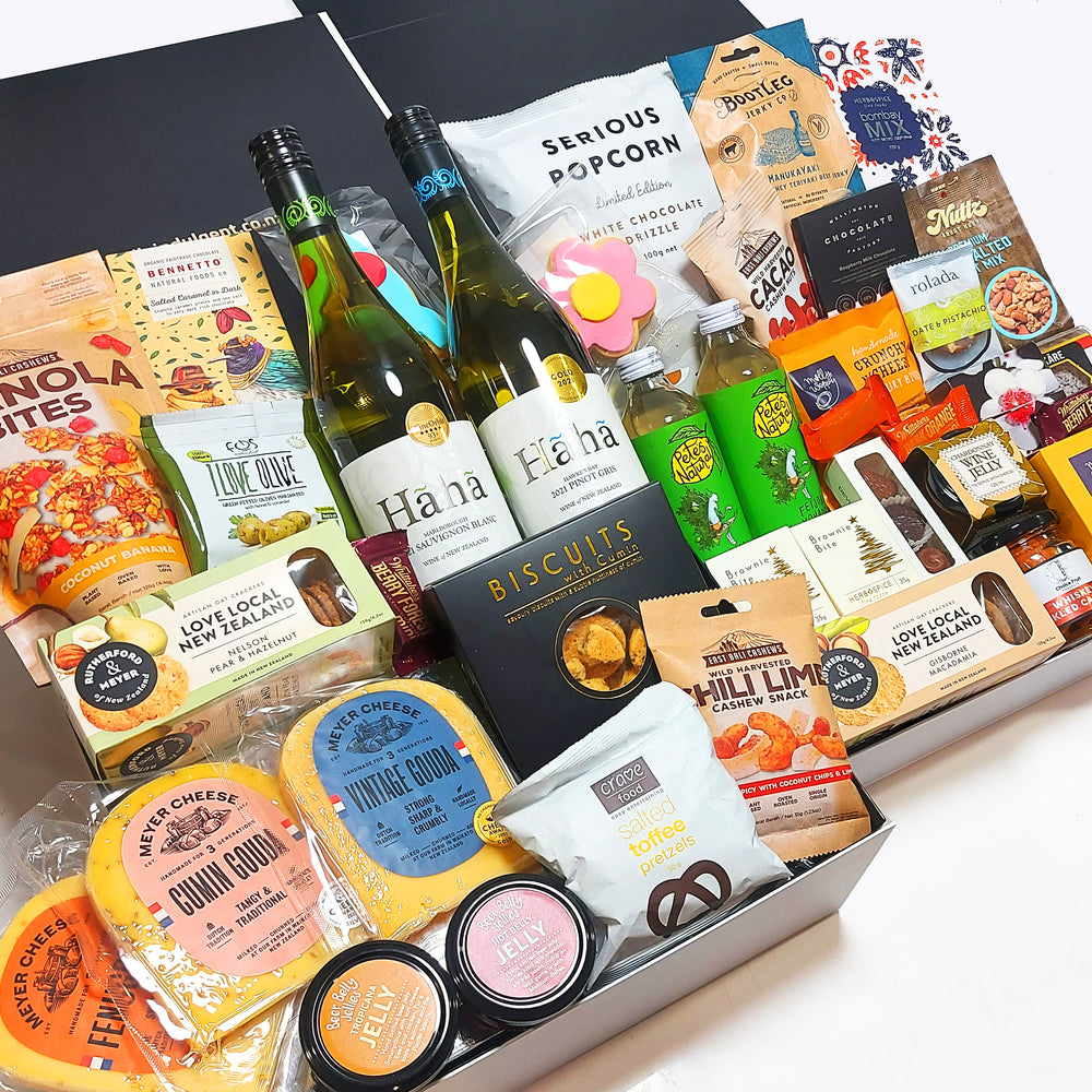 The Crowd Pleaser Hamper includes treats for everyone to savour, with a delicious range of wine, non alcoholic drinks, cheeses, condiments, nuts, chocolate & more.