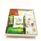 Gluten Free & Dairy Free gift box with frooze balls, cookies, drink, bread mix, olives & Chocolate. Presented in a modern gift box.