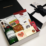 Alcoholic gift basket withTanqueray Gin, chocolate, fudge, chips and more.