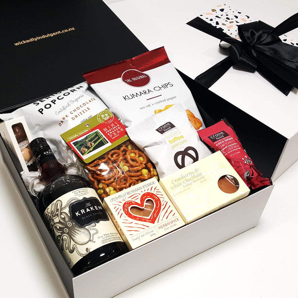Alcoholic gift basket with Kraken Rum, chocolate, fudge, chips and more.